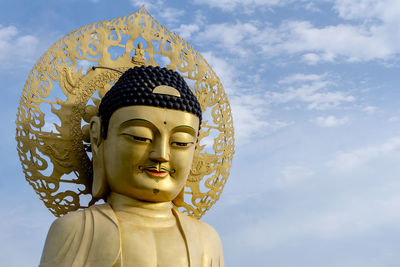Low angle view of statue against sky