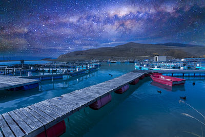 Scenic view of sea against sky at night