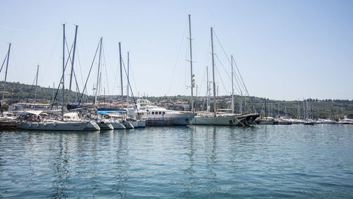 Boats moored at harbor