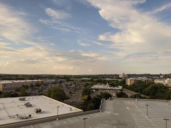 High angle view of street amidst buildings against sky