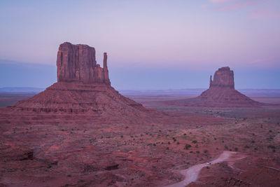 Rock formations in desert during sunset