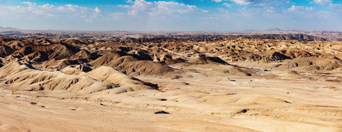 Panoramic view of desert against sky