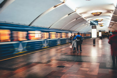 Blurred motion of train at railroad station