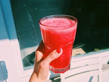 Close-up of hand holding drink