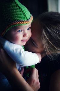 Portrait of mother and cute baby boy with blue eyes