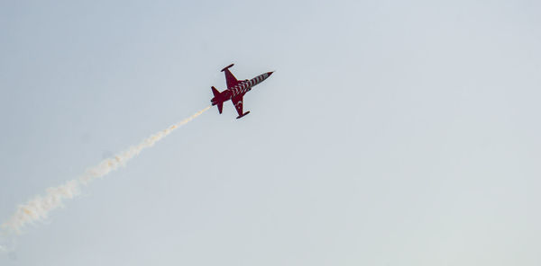 Low angle view of airshow in sky