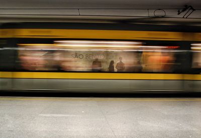 Blurred motion of train at railroad station