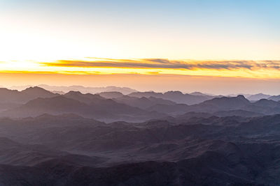 Scenic view of mountains against sky during sunset