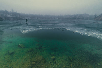 Scenic view of sea against sky during winter