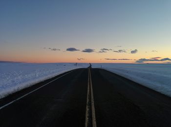 Scenic view of beach against sky during sunset