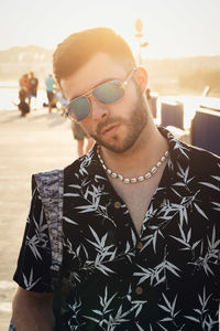 Young man wearing sunglasses standing outdoors