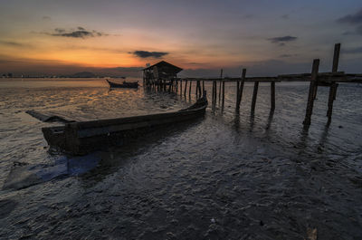 Scenic view of beach against sky during sunset