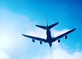 Low angle view of airplane flying in sky