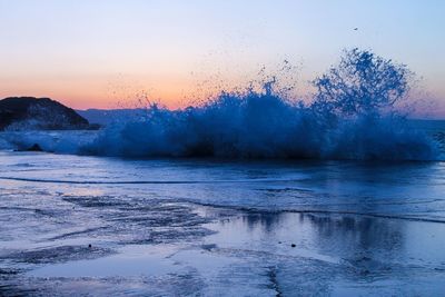 Scenic view of sea at sunset