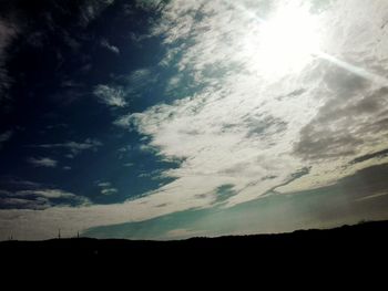 Low angle view of silhouette landscape against sky