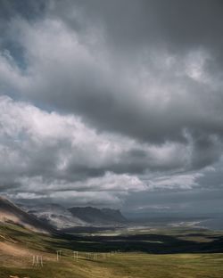 Scenic view of landscape against cloudy sky