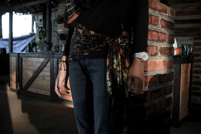 Woman standing in abandoned building