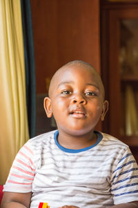 Portrait of boy smiling at home