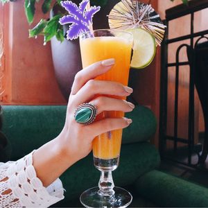 Close-up of woman hand holding juice