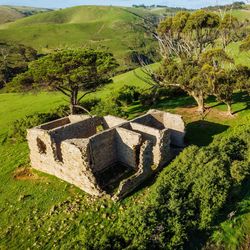 Heritage house in a green field by drone