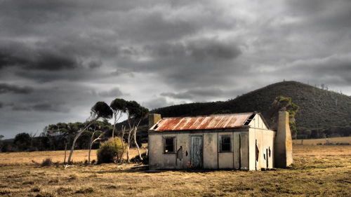 House on landscape against sky