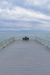 Pier over sea against sky