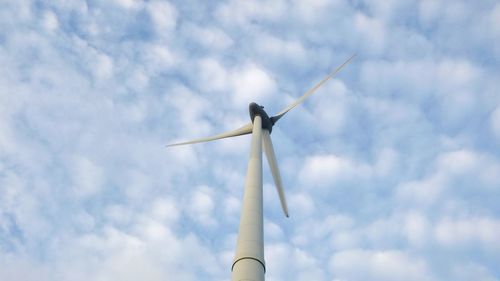 Low angle view of windmill against sky