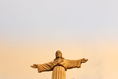 Low angle view of statue against sky
