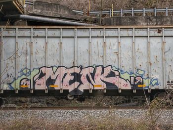 Graffiti on train at railroad station