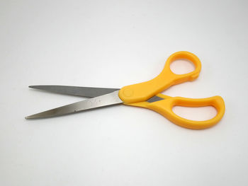 High angle view of yellow pencils against white background