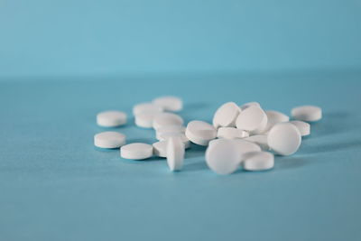 Close-up of pills on blue background