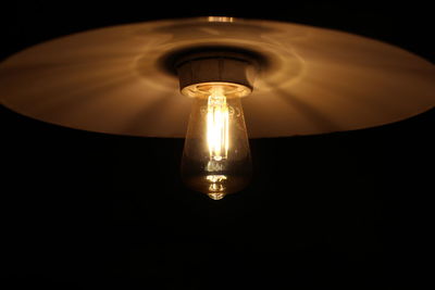 Low angle view of illuminated light bulb