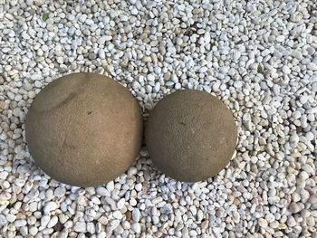 High angle view of stones on pebbles