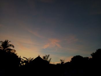 Silhouette trees against sky during sunset