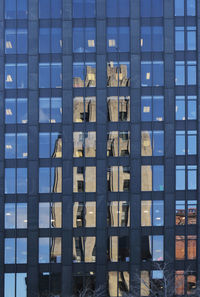 Reflection of building in swimming pool