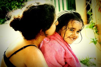 Rear view of mother and daughter