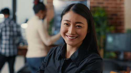 Portrait of smiling businesswoman in office