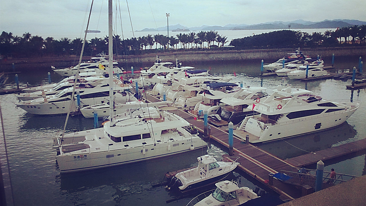 nautical vessel, transportation, mode of transport, sea, moored, water, boat, beach, sky, harbor, shore, sand, incidental people, travel, cloud - sky, high angle view, nature, outdoors, day, vacations