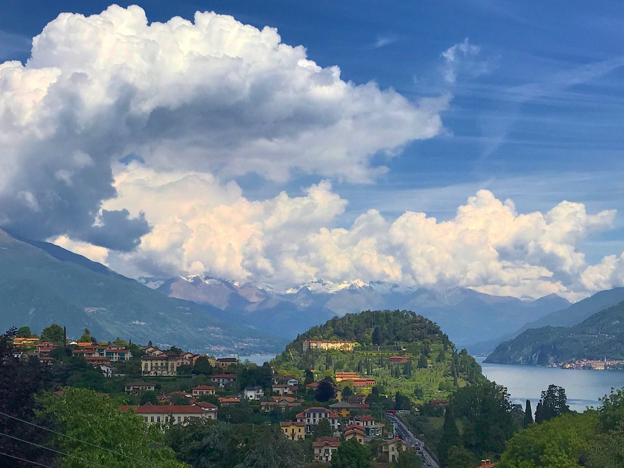 mountain, sky, cloud - sky, beauty in nature, mountain range, scenics, nature, built structure, day, no people, architecture, outdoors, building exterior, blue, landscape, tree, water, range