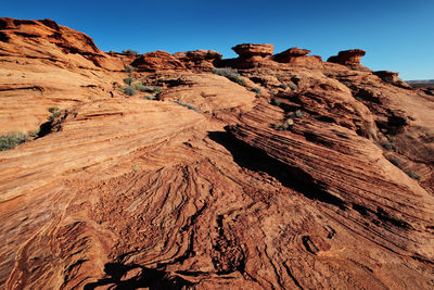 Rock formation on mountain against sky