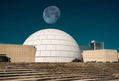 Low angle view of moon against sky at night