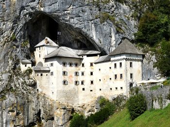 Low angle view of buildings against mountain