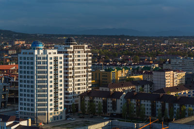 High angle view of buildings in city against sky