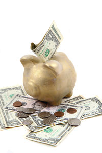 Close-up of coins on table against white background