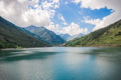 Scenic view of lake and mountains against sky