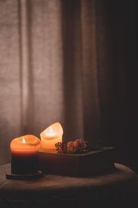 Close-up of tea light candles on table