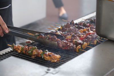High angle view of meat on barbecue grill