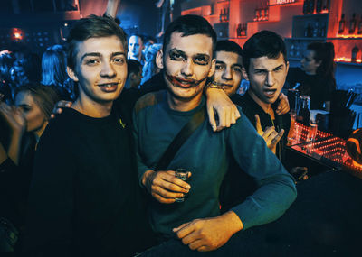 Portrait of a smiling young man at night
