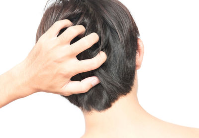 Close-up of hands over white background