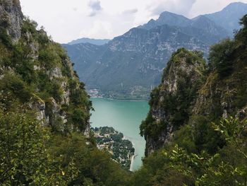 High angle view of lake amidst trees and mountains